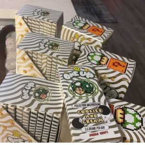 One Up Cookies and Cream Mushroom Bar packaging with black and white wavy design and space mushroom logo